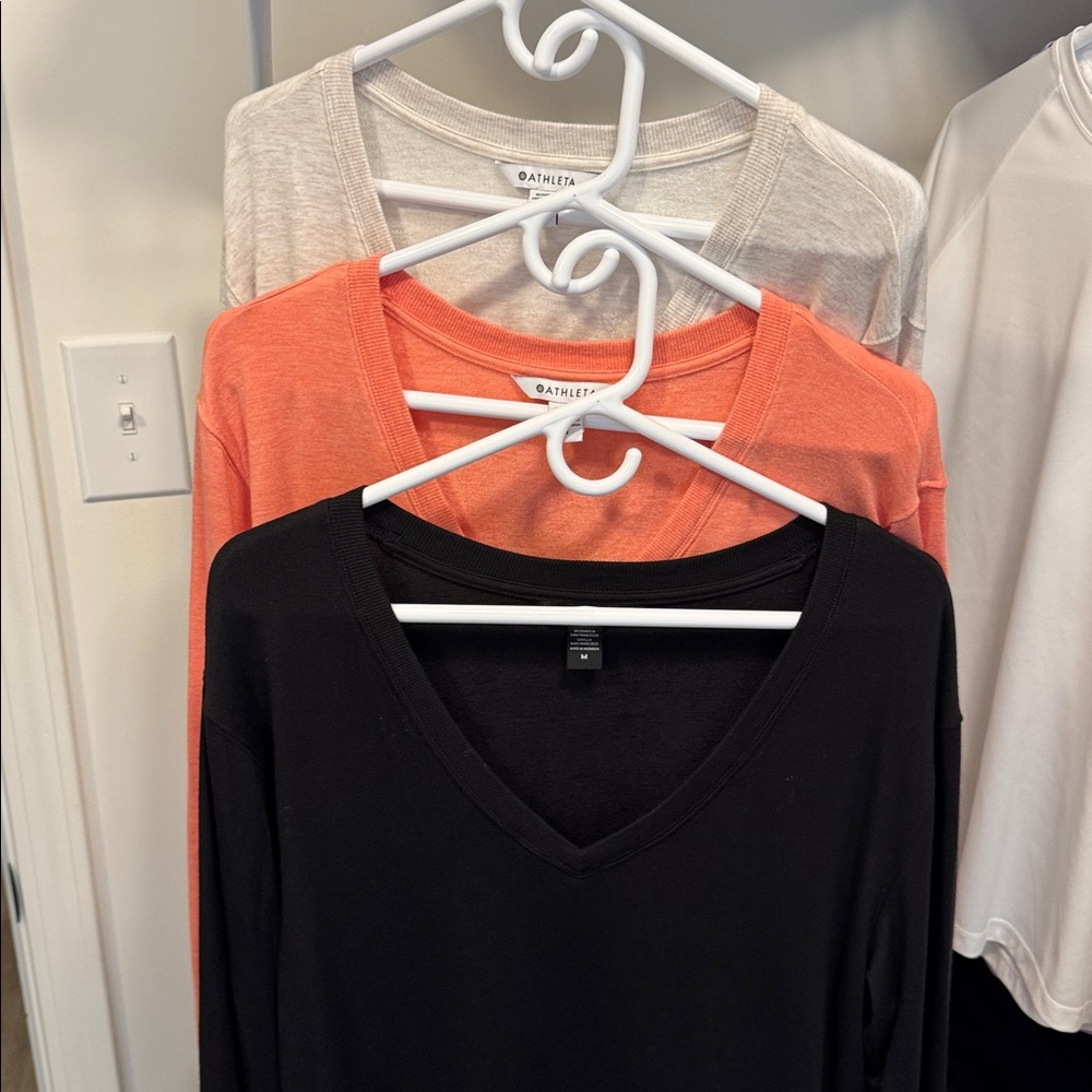 Athleta 3 shirts! Size Medium
Sunrise V-neck sweatshirts